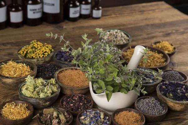 Natural remedy,Herbal medicine and wooden table background — Stock Photo, Image