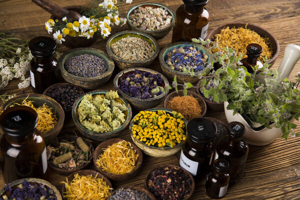 Herbs medicine and vintage wooden background