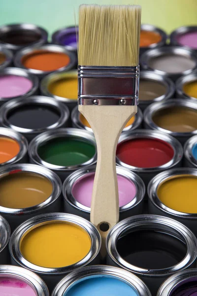 Metal tin cans with color paint and paintbrush — Stock Photo, Image