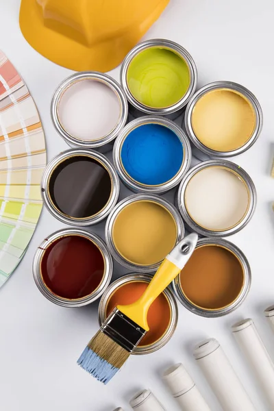 Paint brush, tin can and color guide samples — Stock Photo, Image