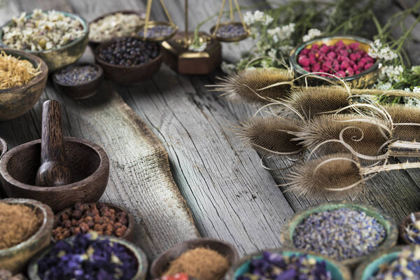 Herbs medicine and vintage wooden background