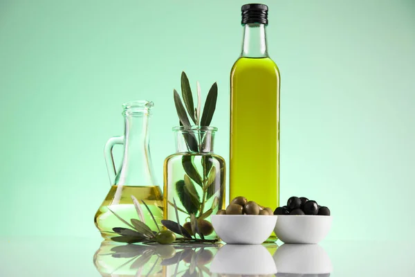 Olive oil bottles, olive branch and Cooking oils