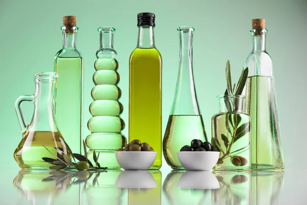 Olive oil bottles, olive branch and Cooking oils