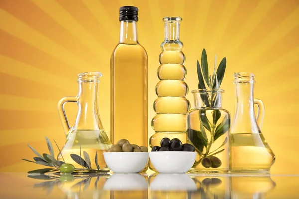 Olive oil bottles, olive branch and Cooking oils