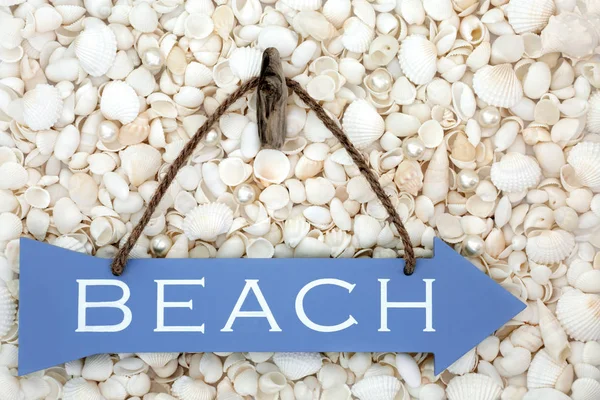 Beach Sign on Seashells and Pearls — Stock Photo, Image