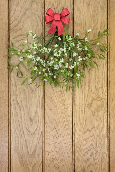 Christmas Mistletoe with Red Bow — Stock Photo, Image