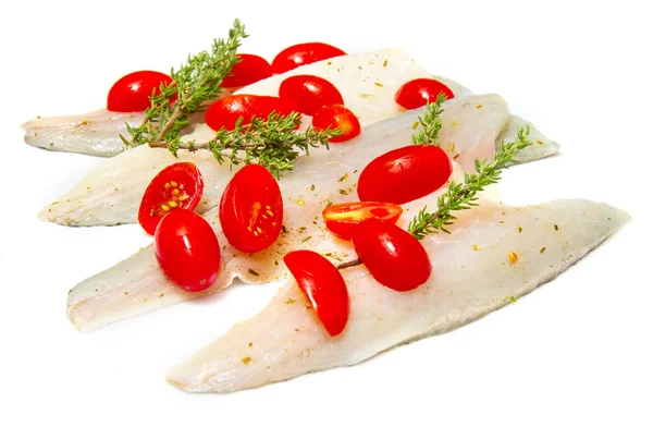 Raw sea bass fillets with cherry tomatoes on white — Stock Photo, Image