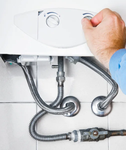 Plumber at work. Servicing gas boiler — Stock Photo, Image