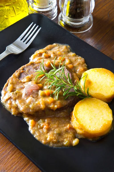 Braised meat with polenta — Stock Photo, Image