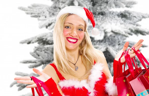 Glückliche junge Frau mit Weihnachtstasche — Stockfoto