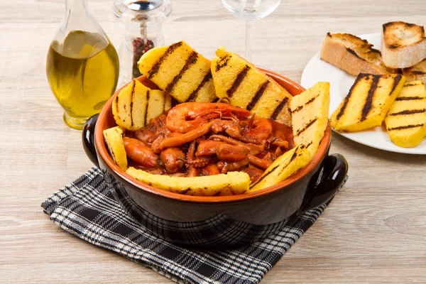 Fish soup with grilled polenta — Stock Photo, Image