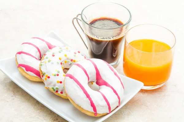 Donuts in white plate — Stock Photo, Image