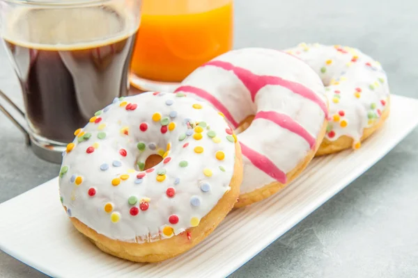 Dish with assorted donuts — Stock Photo, Image