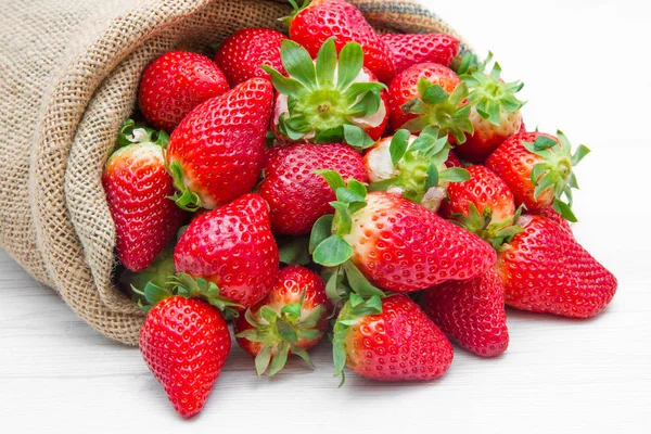 Canvas sack full of  red strawberry — Stock Photo, Image