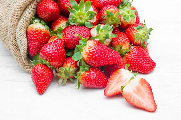 Canvas sack full of  red strawberry — Stock Photo, Image