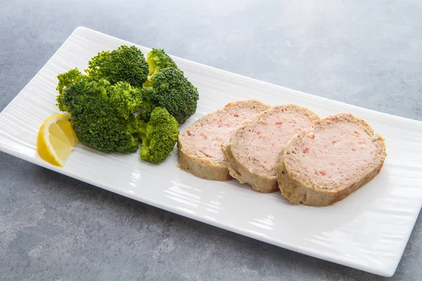 plate of meat loaf with broccoli