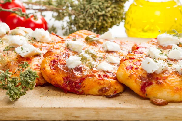 Tris of mixed pizza on wood with ingredients — Stock Photo, Image