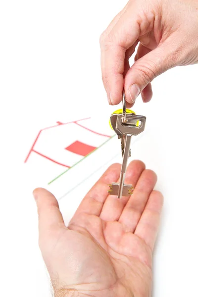 Man handing a women a set of keys — Stock Photo, Image