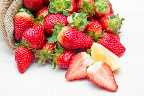 Canvas sack full of  red strawberry — Stock Photo, Image