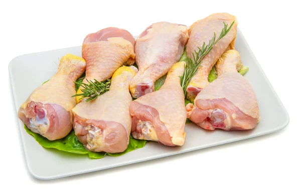 Cosce di pollo su piatto bianco e sfondo bianco — Foto Stock
