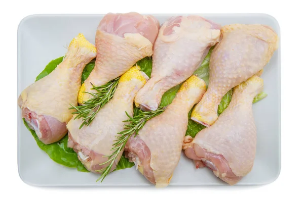 Chicken thighs on white plate and white background — Stock Photo, Image