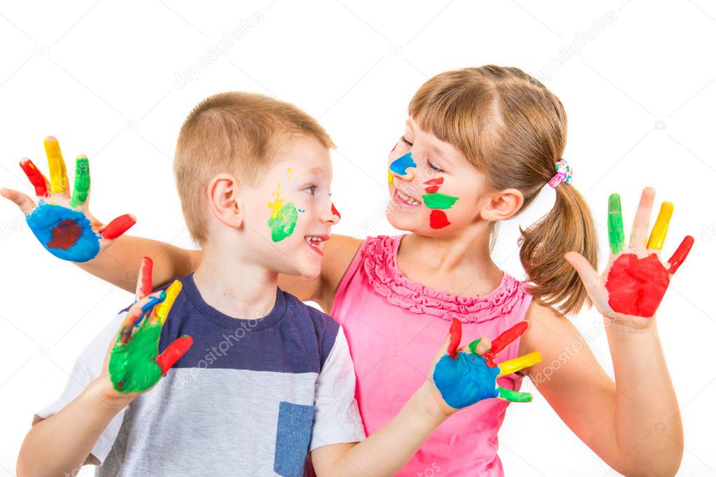 little smiling children with hand painted in colorful paints