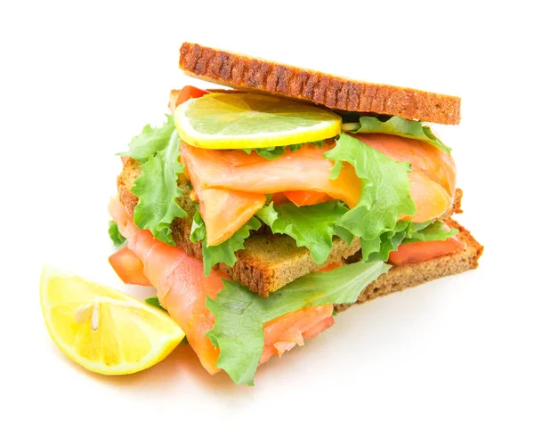 Sandwich with smoked salmon,salad and lemon — Stock Photo, Image