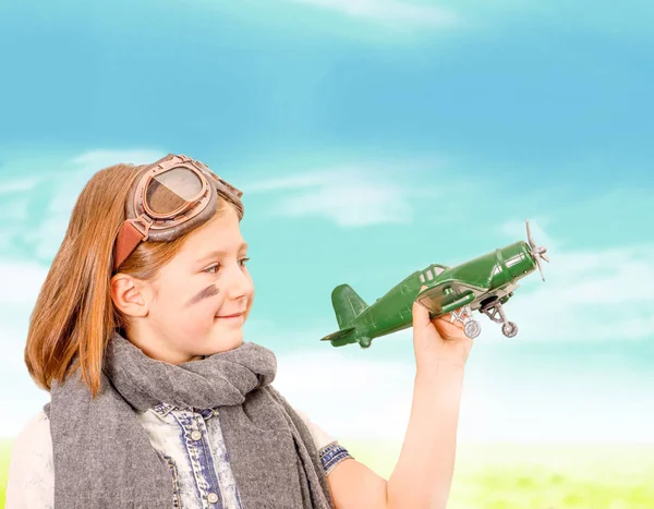 Young aviator  playing with toy airplane — Stock Photo, Image
