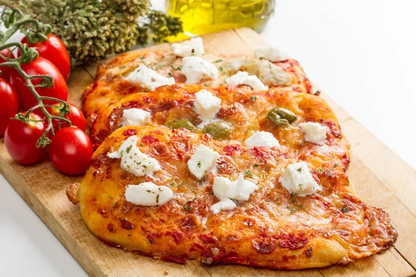 Tris of mixed pizza on wood with ingredients — Stock Photo, Image