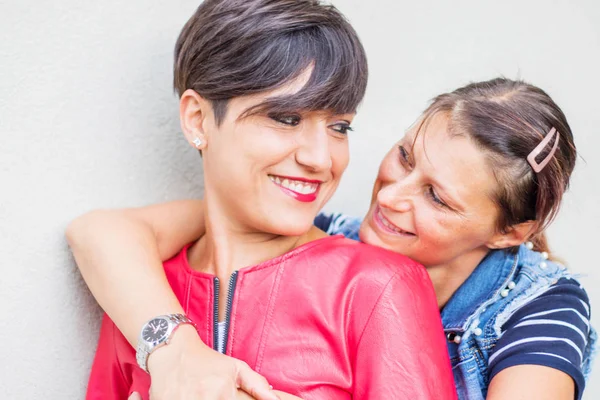 Happy playful girlfriends in love sharing time together — Stock Photo, Image