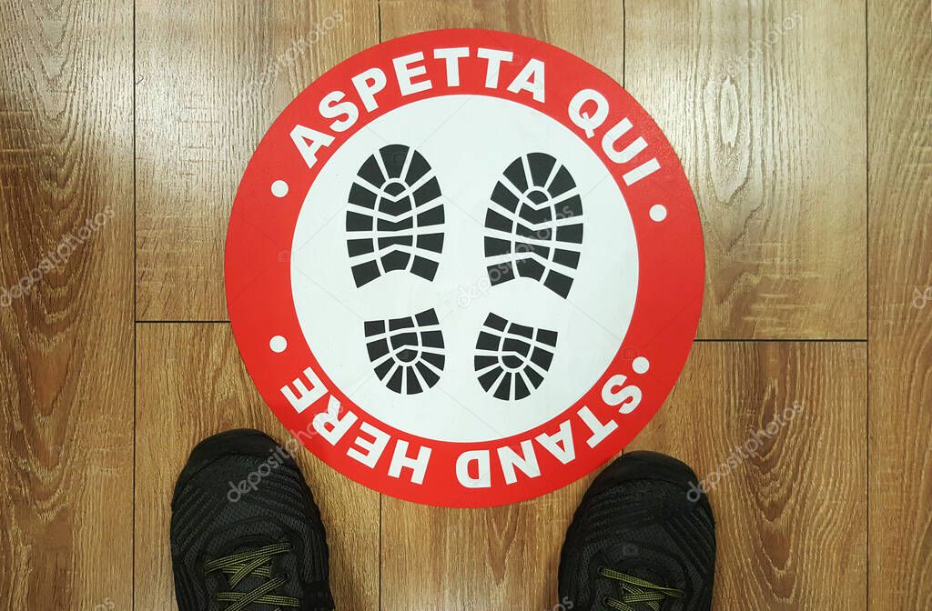 Footprint sign red color with text 