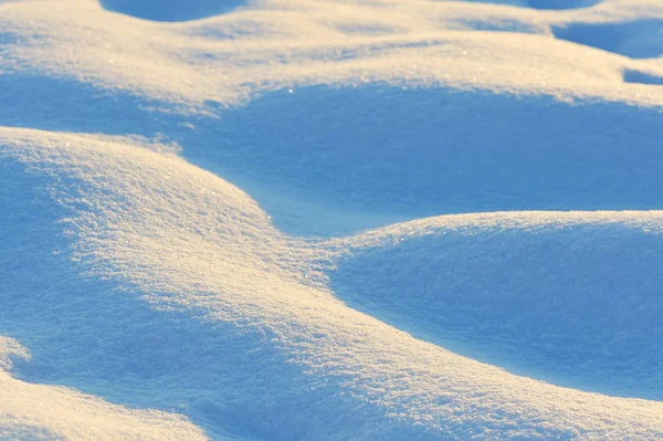 Wavy fresh snow with blue tint — Stock Photo, Image