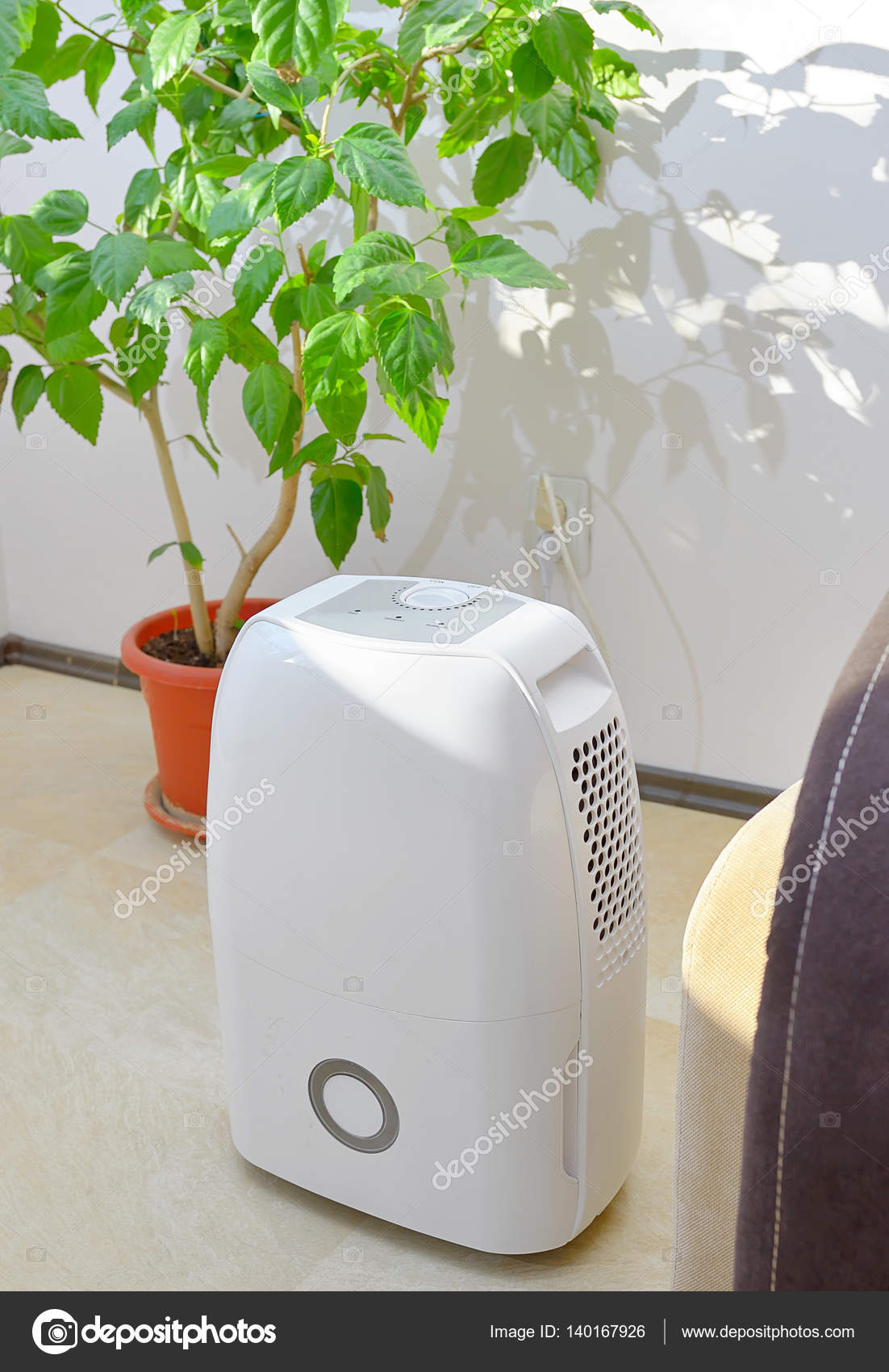 Portable dehumidifier colect water from air Stock Photo by ©jordache 140167926