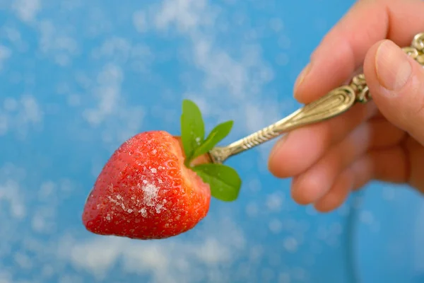 A heart shaped strawberry in spoon — Stock Photo, Image