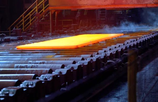 Hot steel plate on conveyor — Stock Photo, Image