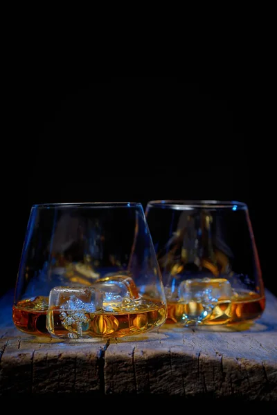 Glass of scotch whiskey and ice isolated — Stock Photo, Image