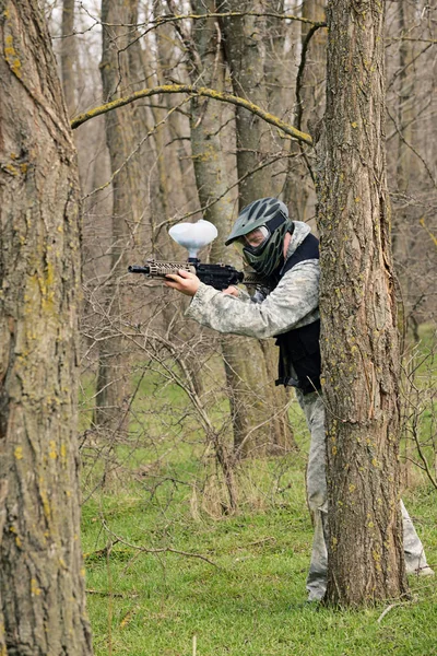 Paintball player under attack — Stock Photo, Image