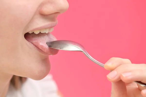Woman Cleaning Tongue Using Spoon — Stock Photo, Image
