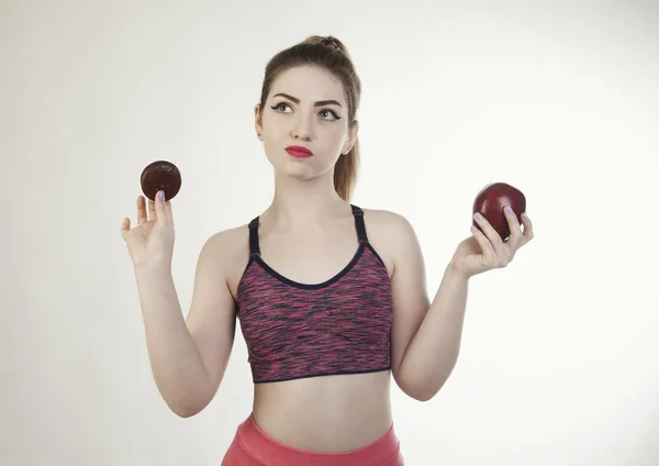 Young woman diet chokolatte and apple choice — Stock Photo, Image