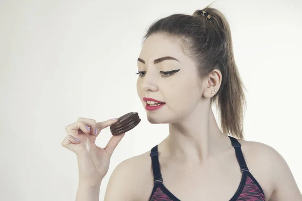 Woman sport eat chocolatte isolated photo portrait — Stock Photo, Image