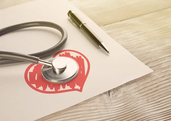White wooden background with medic Stethoscope and hand drawn he