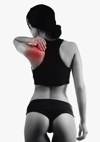 Hermosa mujer deportiva muscular espalda con zona de dolor aislado — Foto de Stock