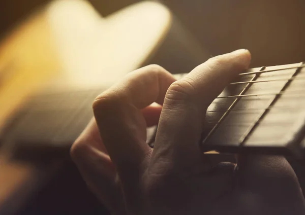 Guitar close up hand light effect toning photo — Stock Photo, Image