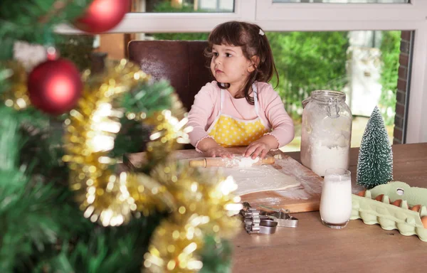 Cute child is making cookies for Christmas — Stock Photo, Image