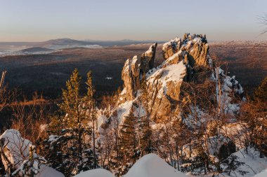 Rock city stone Butte in the winter the Ural mountains at sunrise clipart