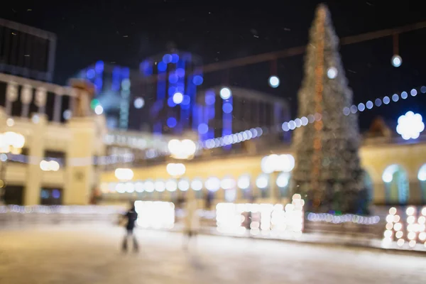 Defocused outdoor ice skating rink with blurred people in winter — Stock Photo, Image