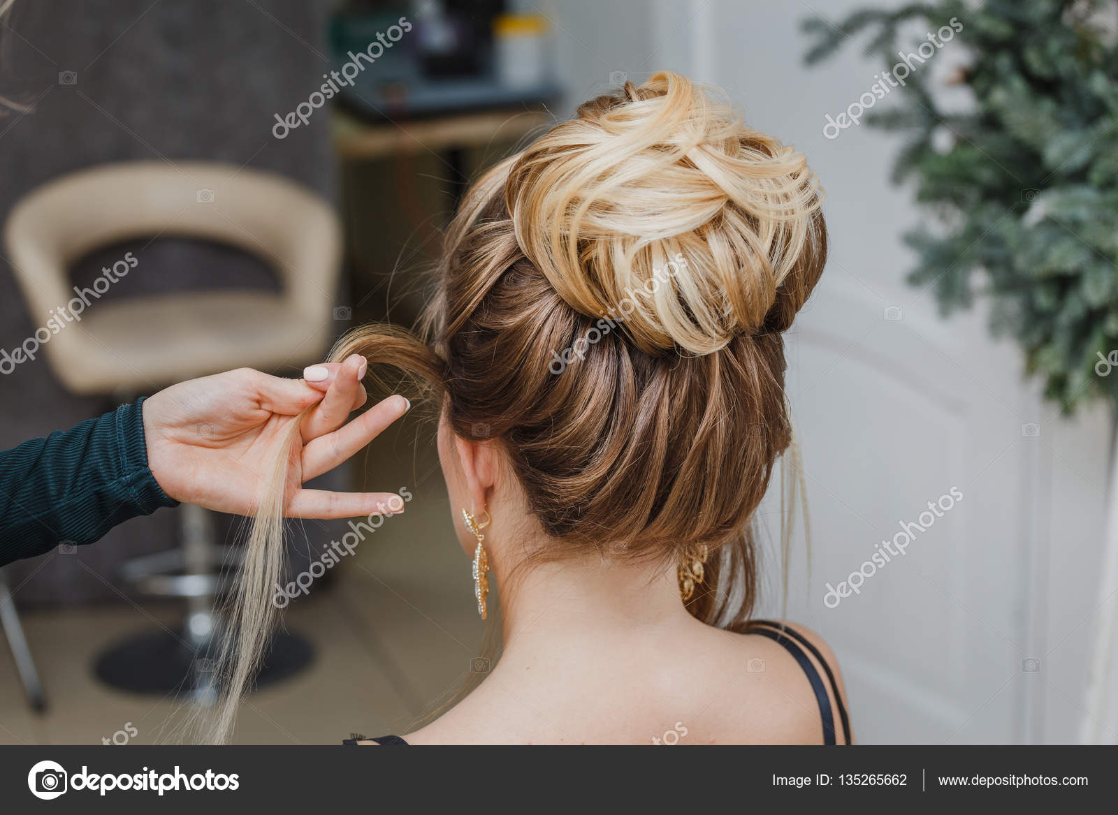 Hairdresser makes complex and beautiful hairstyle upper bun. Suitable for  evening and wedding style Stock Photo by ©frantic00 135265662