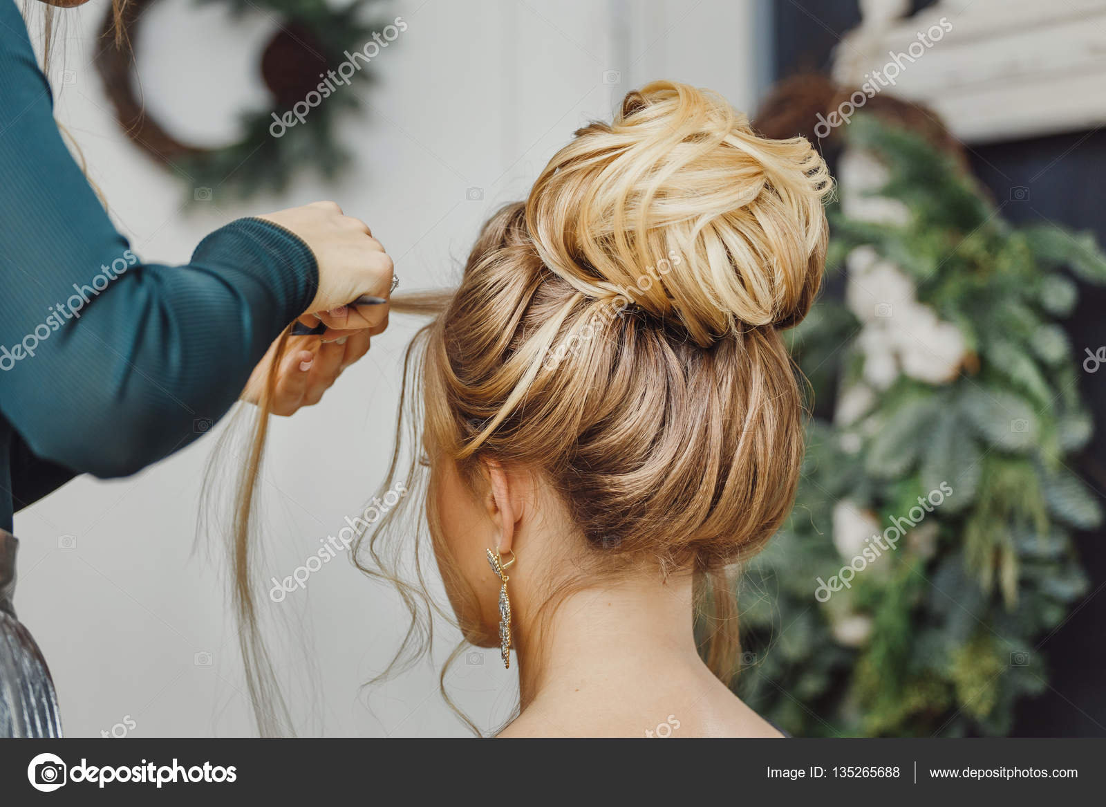 Hairdresser makes complex and beautiful hairstyle upper bun. Suitable for  evening and wedding style Stock Photo by ©frantic00 135265688