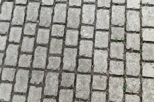 Abstrakter Straßenhintergrund - graue Pflasterplatten in Form von Plätzen im Freien — Stockfoto