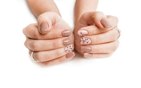 Kvinnlig hand med nailart isolerad på en vit bakgrund — Stockfoto
